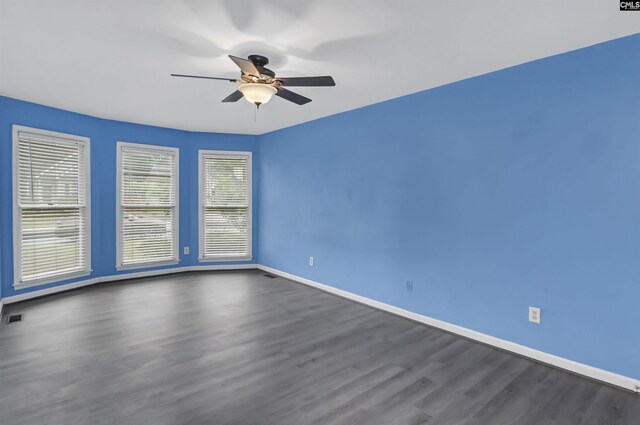 105 Golden Pond Dr, Lexington, SC 29073 - spare room featuring dark wood-type flooring, baseboards, and ceiling fan