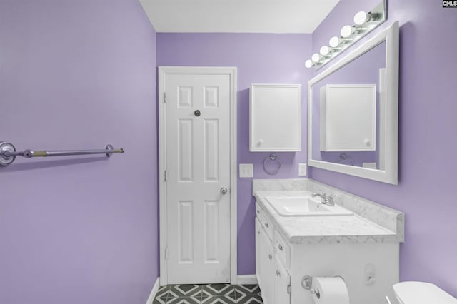 105 Golden Pond Dr, Lexington, SC 29073 - bathroom with toilet, vanity, tile patterned floors, and baseboards