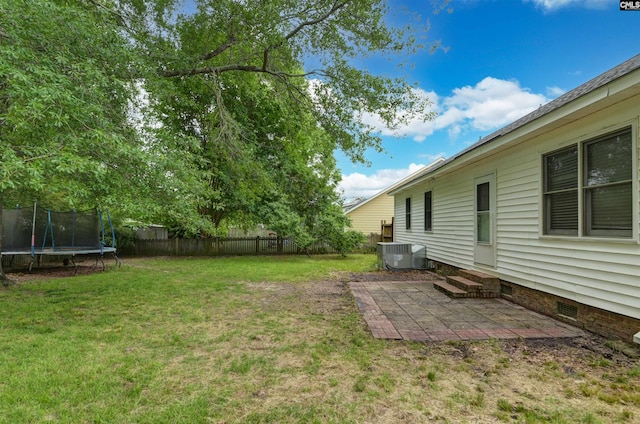 105 Golden Pond Dr, Lexington, SC 29073 - view of yard with a trampoline, entry steps, a patio, and central AC unit