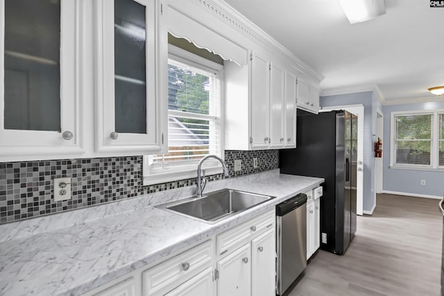 105 Golden Pond Dr, Lexington, SC 29073 - kitchen featuring dishwasher, a sink, white cabinets, light wood finished floors, and backsplash