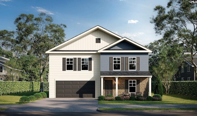 view of front facade featuring a garage, driveway, stone siding, covered porch, and a front yard