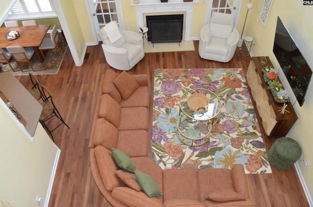 5102 Circle Dr, Columbia, SC 29206 - living room featuring wood finished floors, baseboards, and a glass covered fireplace