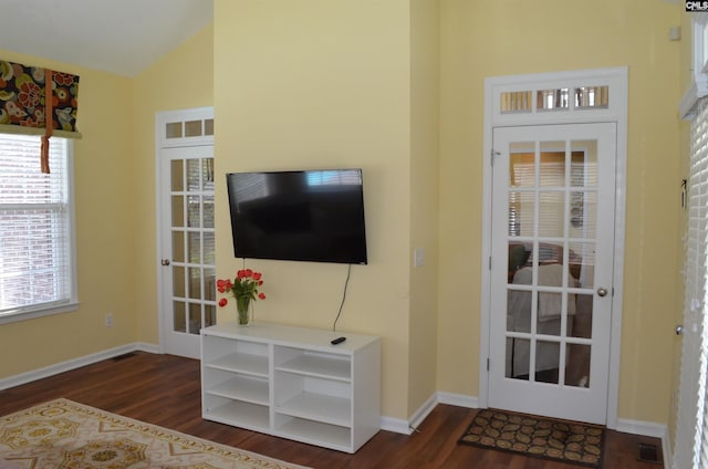 5102 Circle Dr, Columbia, SC 29206 - living room featuring dark wood-type flooring, lofted ceiling, and baseboards
