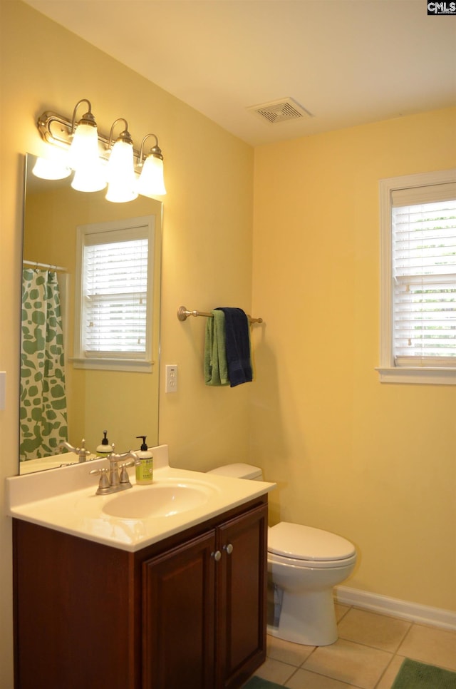 5102 Circle Dr, Columbia, SC 29206 - bathroom featuring tile patterned flooring, plenty of natural light, vanity, and toilet