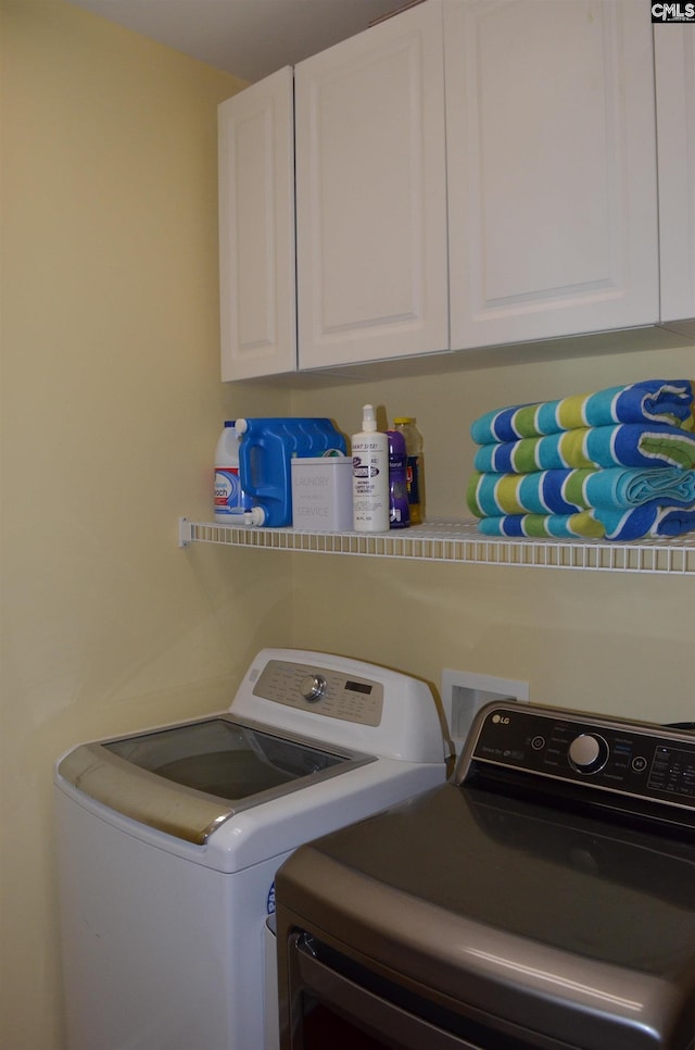 5102 Circle Dr, Columbia, SC 29206 - laundry room with washing machine and clothes dryer and cabinet space