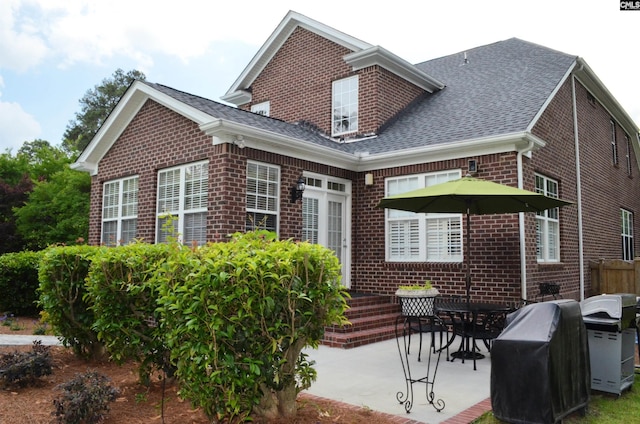 5102 Circle Dr, Columbia, SC 29206 - back of house with brick siding, a patio area, and a shingled roof