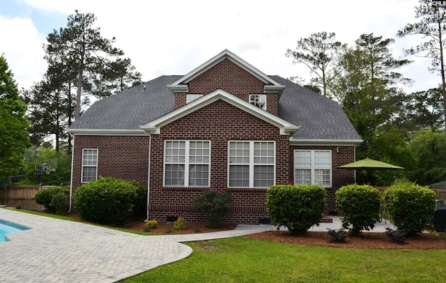5102 Circle Dr, Columbia, SC 29206 - rear view of property featuring brick siding, a yard, a patio area, and roof with shingles