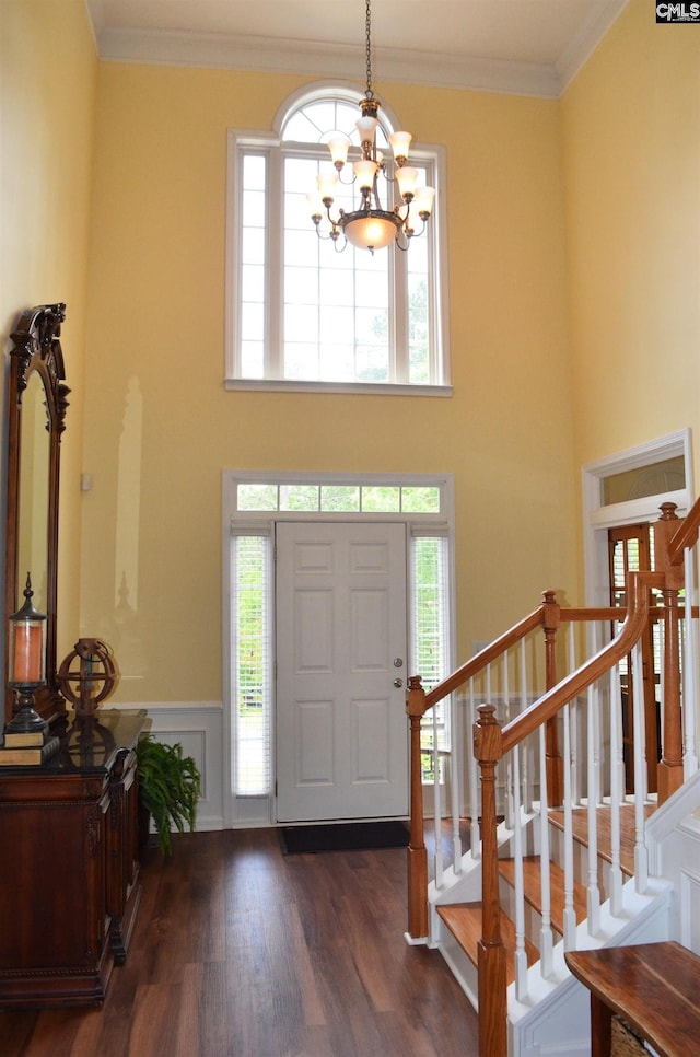 5102 Circle Dr, Columbia, SC 29206 - entrance foyer featuring a chandelier, wood finished floors, a wainscoted wall, stairs, and ornamental molding