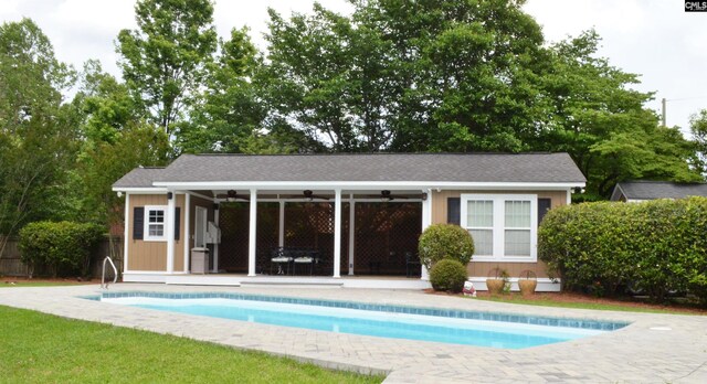 5102 Circle Dr, Columbia, SC 29206 - outdoor pool featuring ceiling fan, an outdoor structure, and an exterior structure