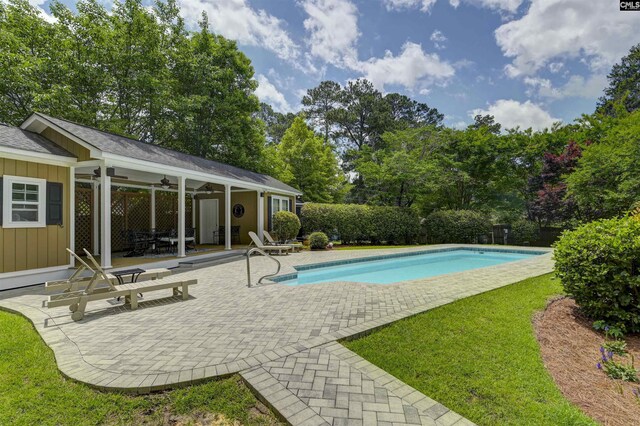 5102 Circle Dr, Columbia, SC 29206 - swimming pool featuring ceiling fan, a patio, and view of scattered trees