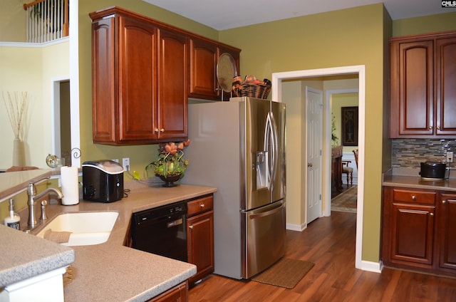 5102 Circle Dr, Columbia, SC 29206 - kitchen with a sink, black dishwasher, light countertops, dark wood-style floors, and decorative backsplash
