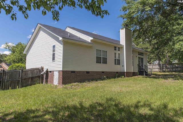 view of home's exterior featuring crawl space, a chimney, and entry steps
