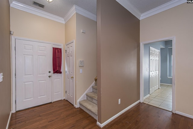 409 Waterville Dr, Columbia, SC 29229 - entryway featuring wood finished floors, crown molding, baseboards, and stairway