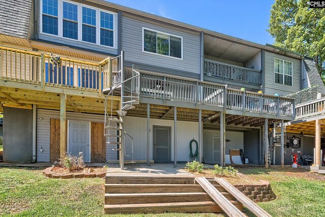 back of house featuring a wooden deck