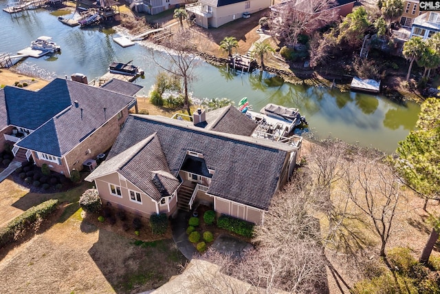 view from above of property featuring a large body of water and a marina