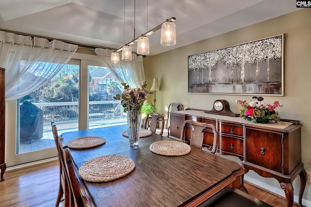 dining space featuring wood finished floors