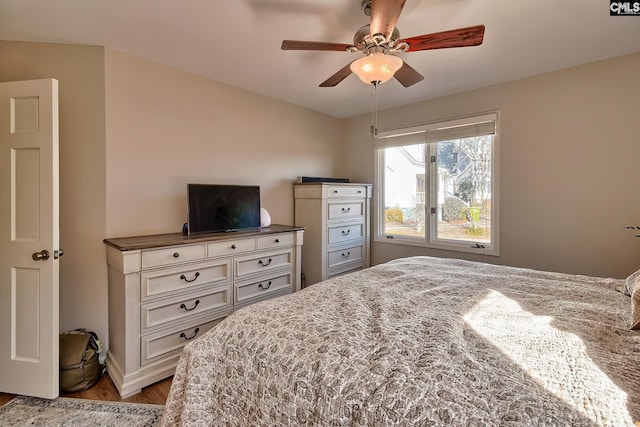 bedroom with light wood-type flooring and a ceiling fan
