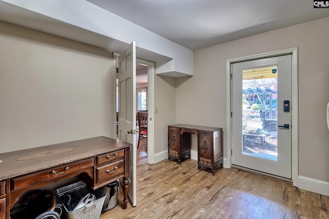 office featuring light wood finished floors and baseboards