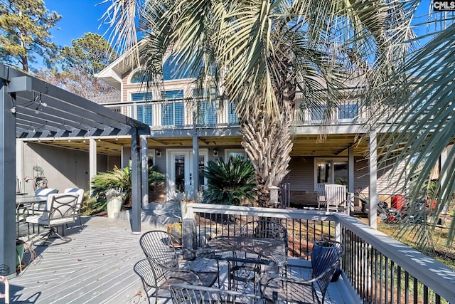 deck with outdoor dining area