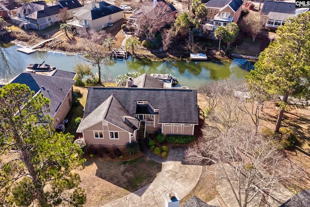 aerial view of residential area with a large body of water