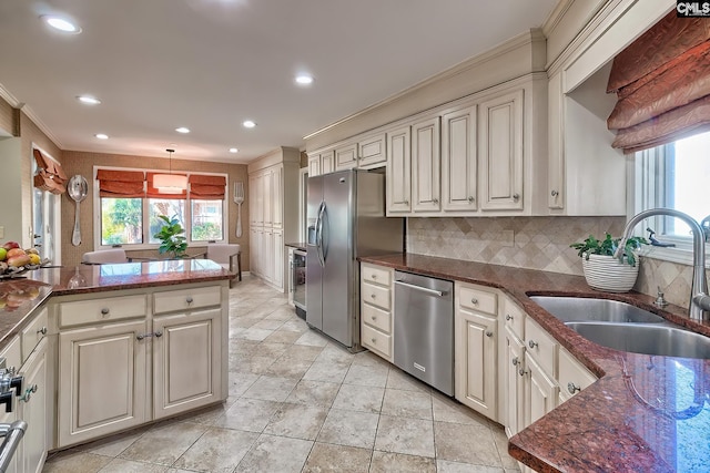 kitchen with stainless steel appliances, a sink, backsplash, ornamental molding, and recessed lighting