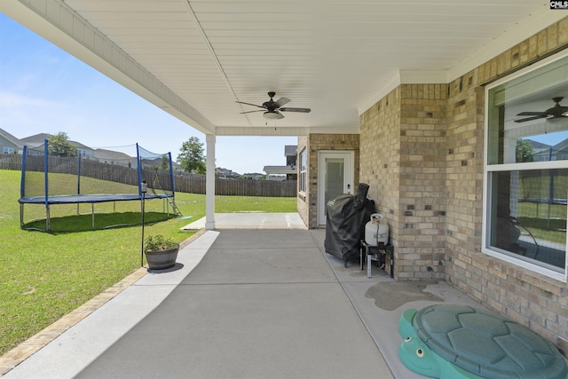 view of patio / terrace with a trampoline and a ceiling fan
