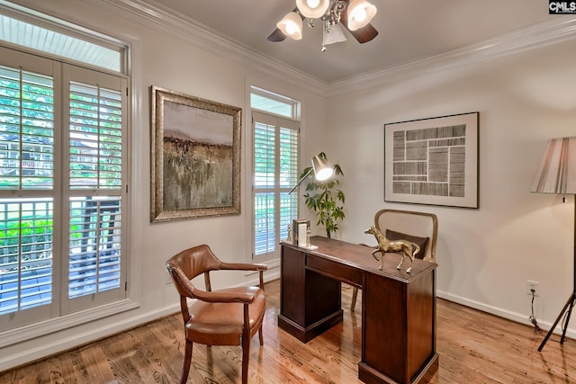 office area featuring ceiling fan, plenty of natural light, ornamental molding, and baseboards