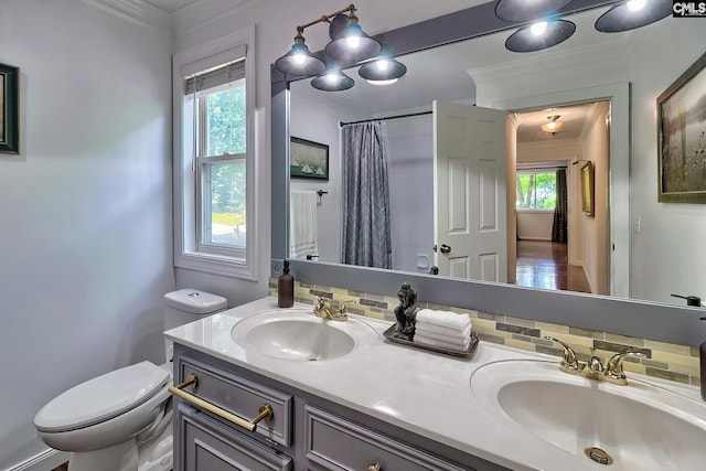 full bathroom with toilet, ornamental molding, double vanity, and a shower with shower curtain
