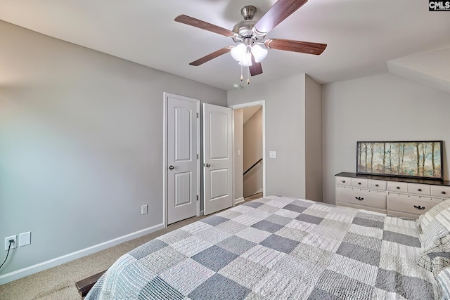carpeted bedroom with baseboards and ceiling fan
