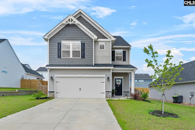 craftsman-style house with stone siding, a garage, and concrete driveway