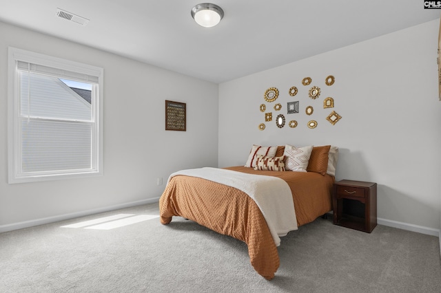 bedroom featuring carpet floors and baseboards