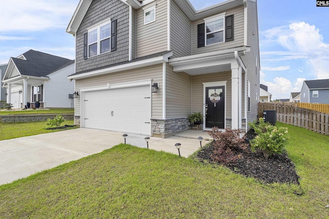 view of front of home with an attached garage, central AC unit, driveway, and stone siding