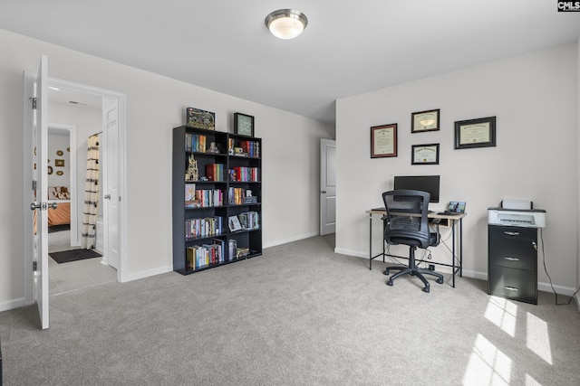carpeted office with baseboards