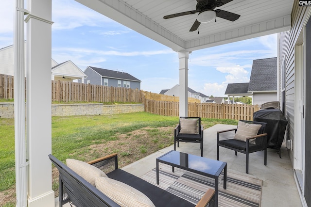 view of patio / terrace featuring a ceiling fan and an outdoor living space