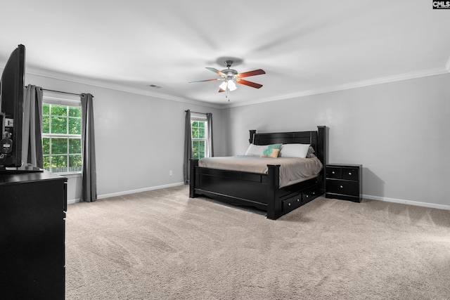 carpeted bedroom with crown molding, multiple windows, baseboards, and a ceiling fan