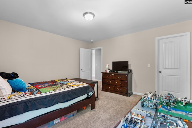 bedroom featuring carpet flooring and baseboards