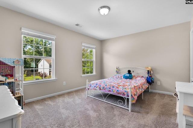 bedroom featuring baseboards and carpet flooring
