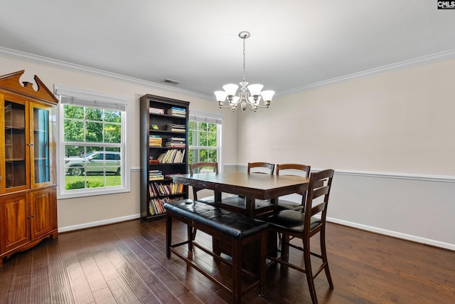 dining room featuring a chandelier, crown molding, baseboards, and dark wood-type flooring