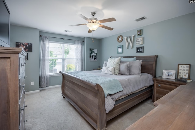 bedroom with baseboards, light carpet, and ceiling fan