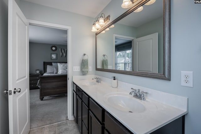 bathroom featuring double vanity, connected bathroom, and tile patterned floors