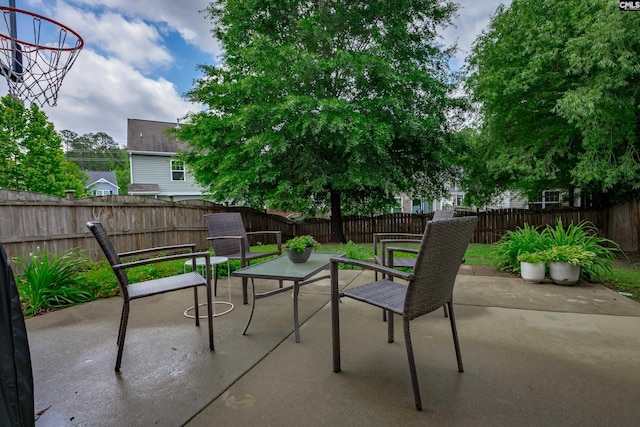 view of patio with a fenced backyard and outdoor dining area