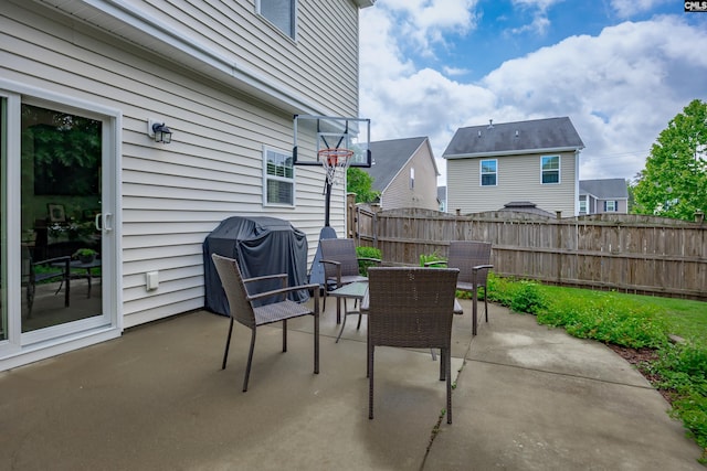 view of patio with a fenced backyard, area for grilling, and outdoor dining space
