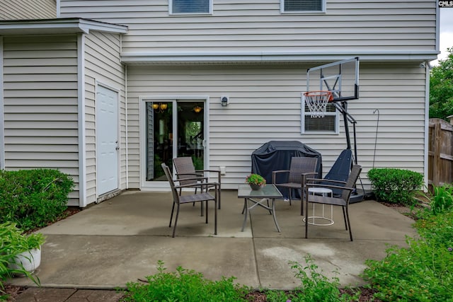 view of patio featuring fence