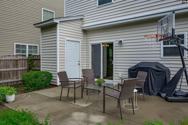 view of patio featuring fence