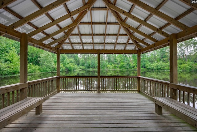 wooden deck featuring a gazebo and a water view