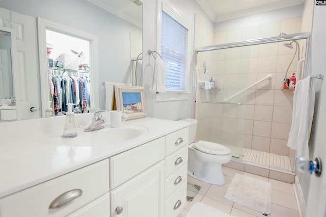 full bathroom featuring a stall shower, ornamental molding, toilet, tile patterned flooring, and vanity