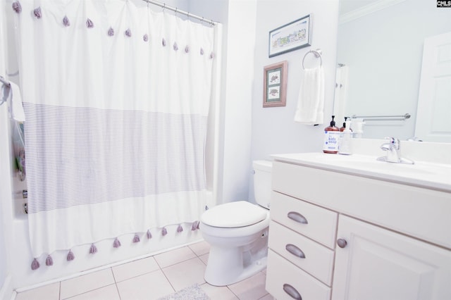 bathroom featuring toilet, tile patterned floors, vanity, shower / bath combination with curtain, and ornamental molding