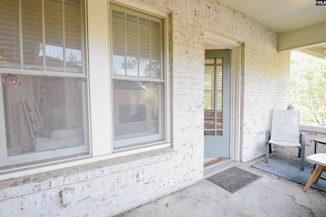 property entrance with brick siding