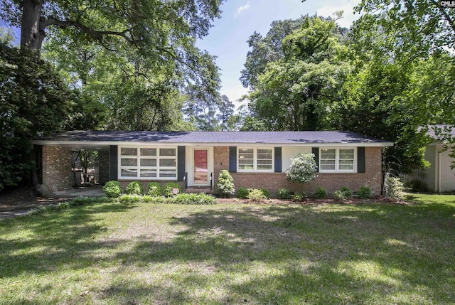 1148 Eastminster Dr, Columbia, SC 29204 - view of front of property featuring brick siding, a front lawn, and an attached carport