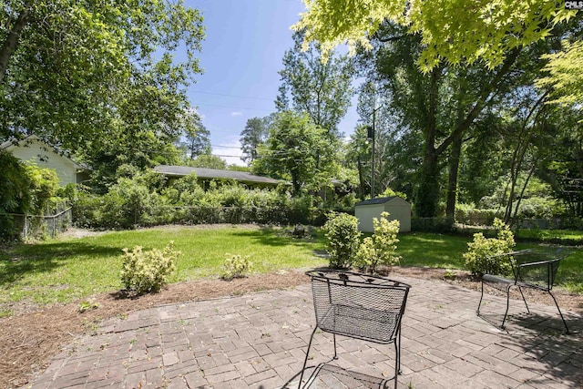 1148 Eastminster Dr, Columbia, SC 29204 - view of patio / terrace with a storage unit and an outbuilding